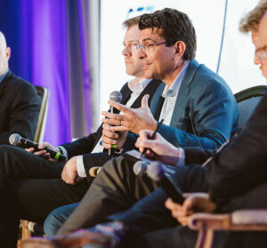speakers onstage at an energy dialogues event