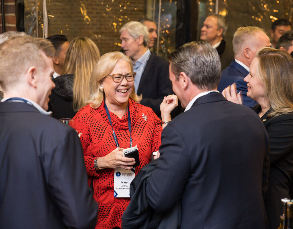 Several event attendees casually talking and connecting after an event.