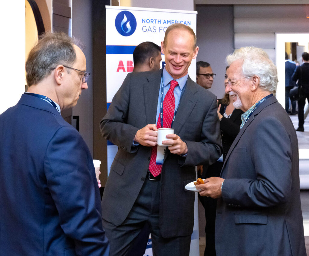 Three event attendees socializing after an event.