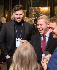 Group of attendees socializing after an event.
