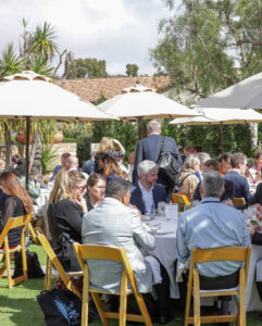 Outdoor luncheon with attendees.
