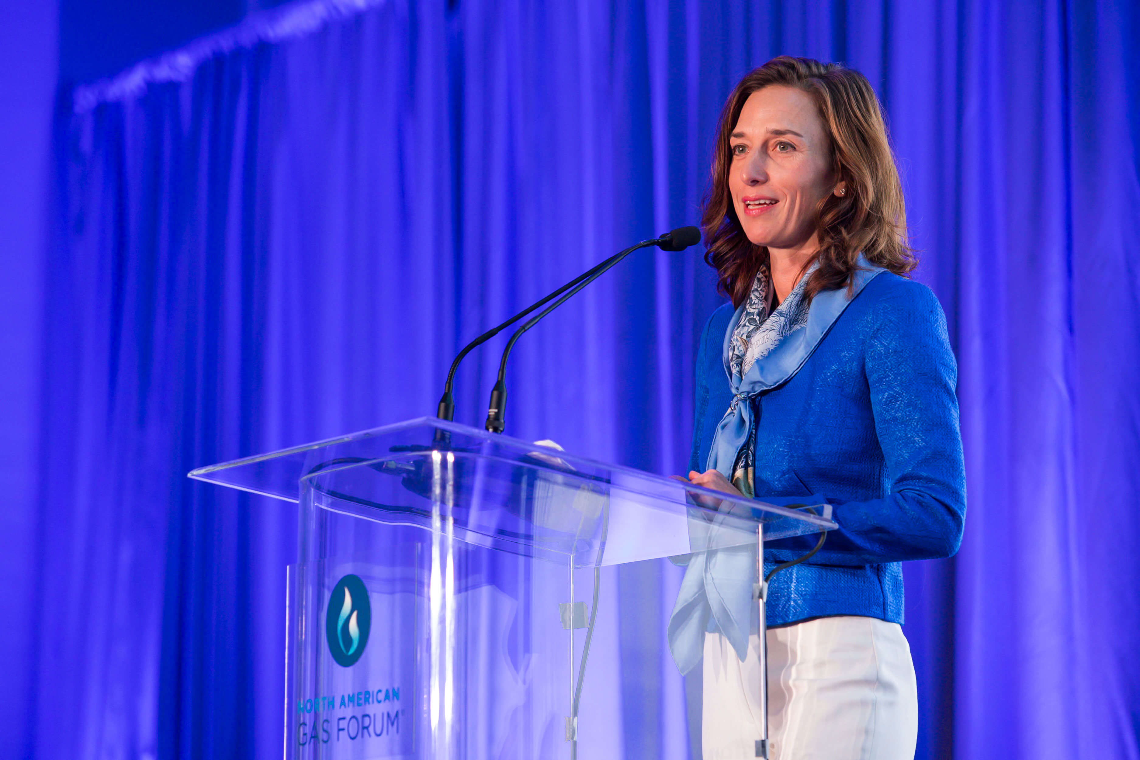 Monika Simoes speaking at event