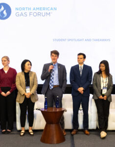 Student speakers on stage.