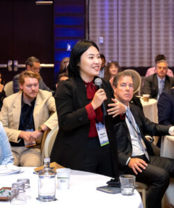 Student speaker to members on stage via the audience.