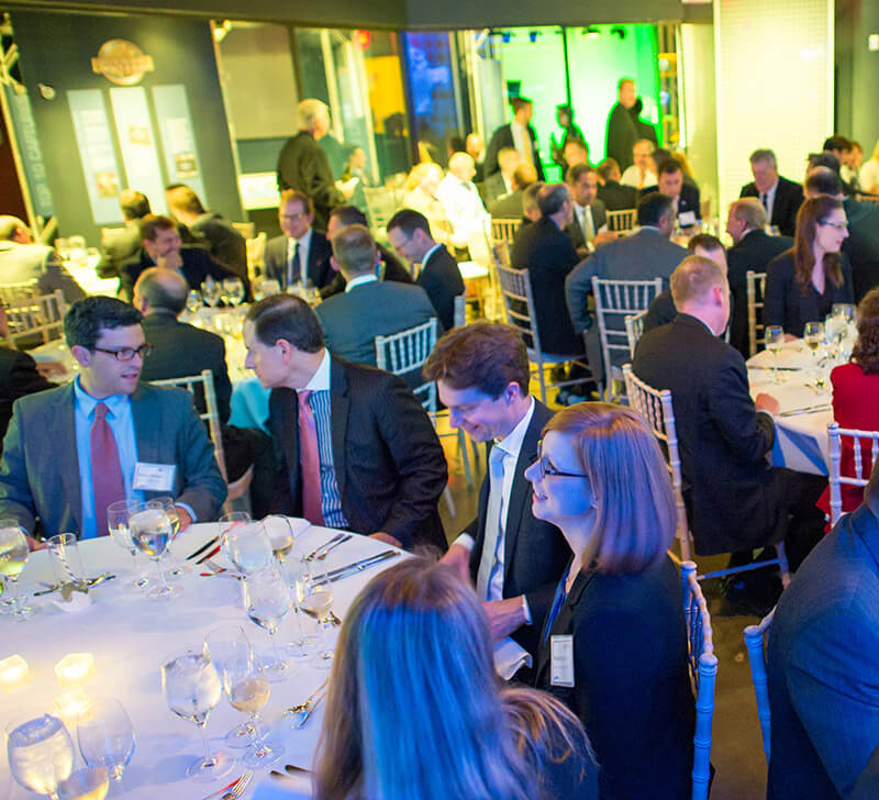 Group of attendees sitting at tables.