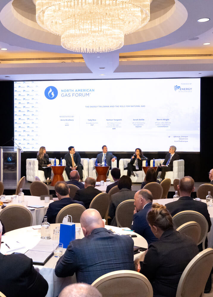 Speakers having discussion on stage.