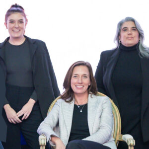 Three Energy Dialogue team members smiling at camera.